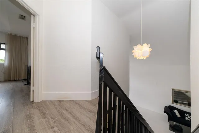 an aerial view of residential houses with outdoor space and street view