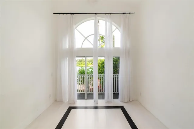 an aerial view of residential houses with outdoor space and street view