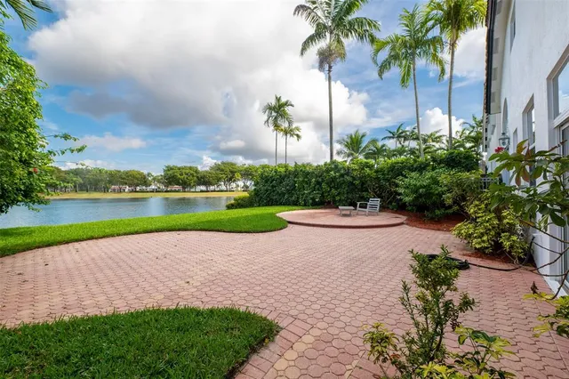 an aerial view of a house with a lake view