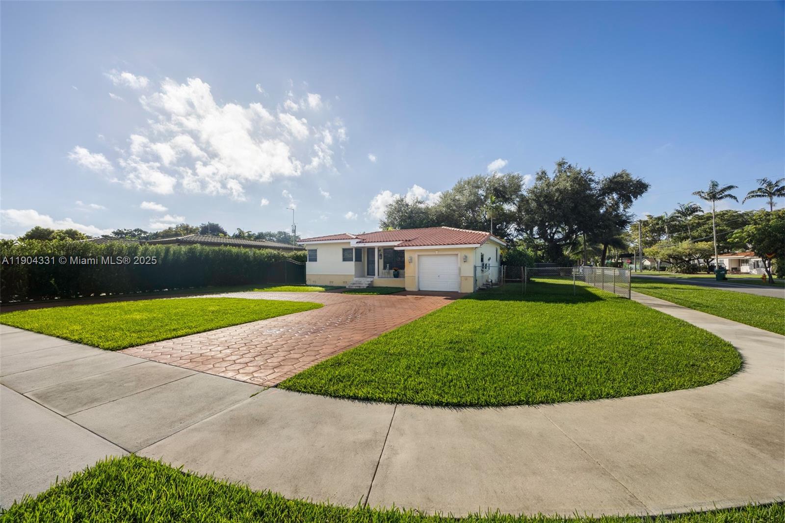 6040 Southwest 29th Street Miami, FL 33155 - Photo 5 of 18 a view of a fountain in front of a house with a big yard