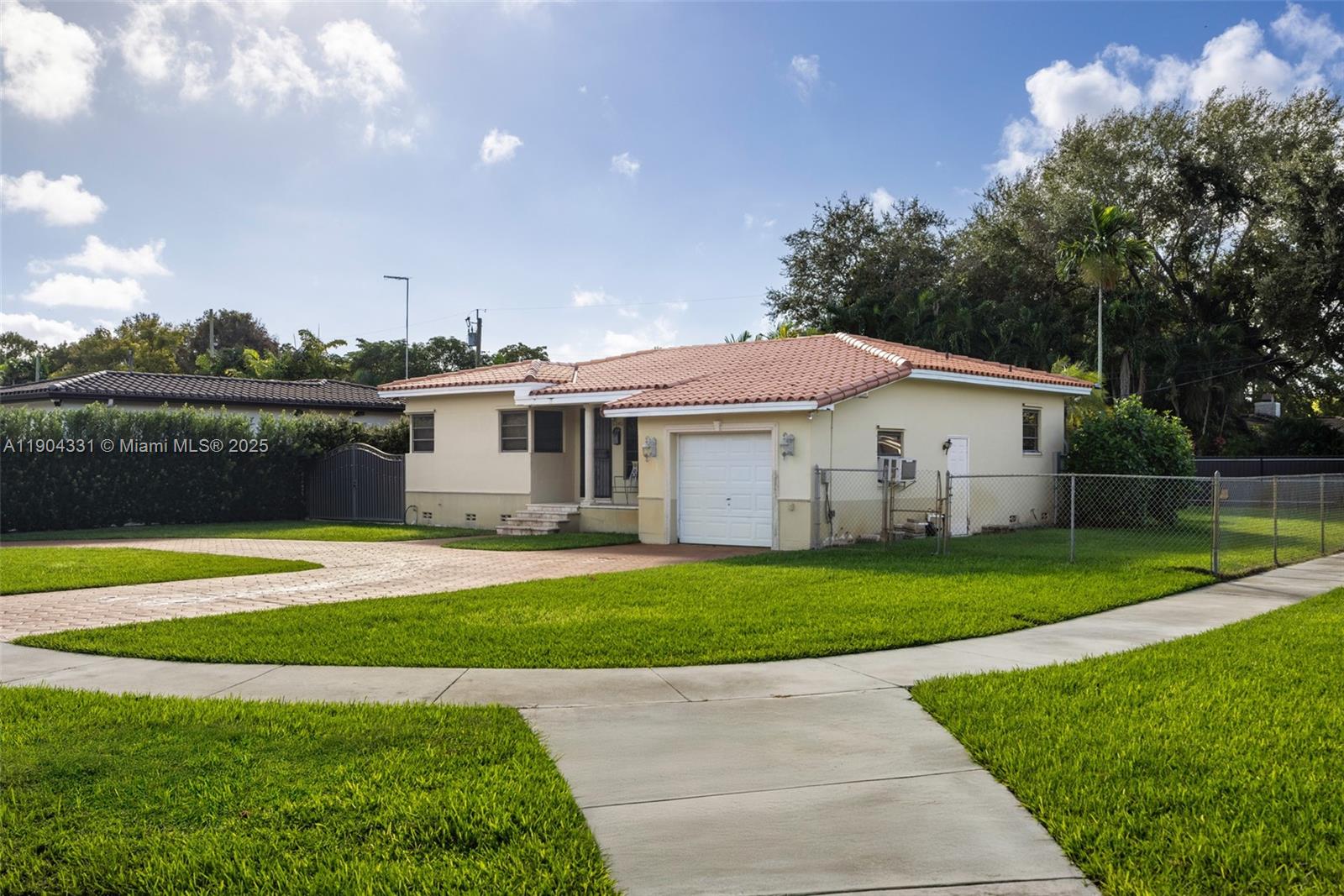 6040 Southwest 29th Street Miami, FL 33155 - Photo 6 of 18 a view of a house with a yard and a patio