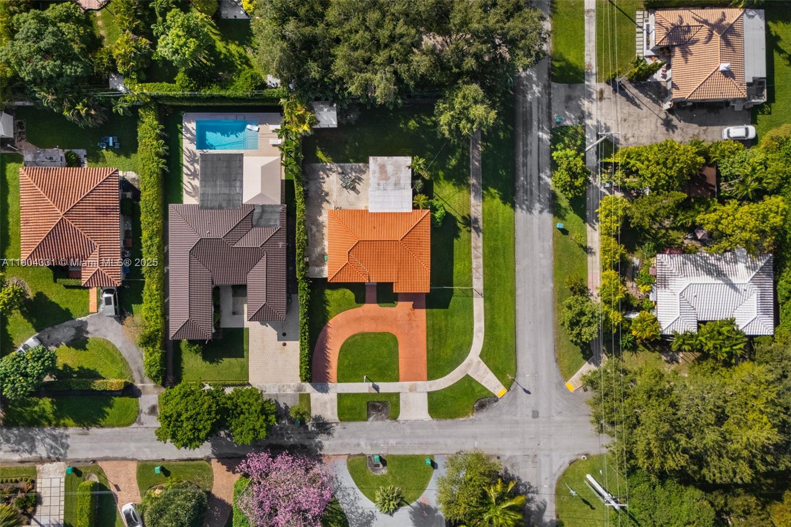 6040 Southwest 29th Street Miami, FL 33155 - Photo 8 of 18 an aerial view of a house with a yard and a large tree
