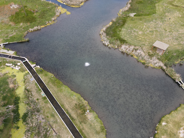 202 North Westhaven Road Richfield, UT 84701 - Photo 9 of 10 Extensive waterways featuring a fountain and a wooden gazebo