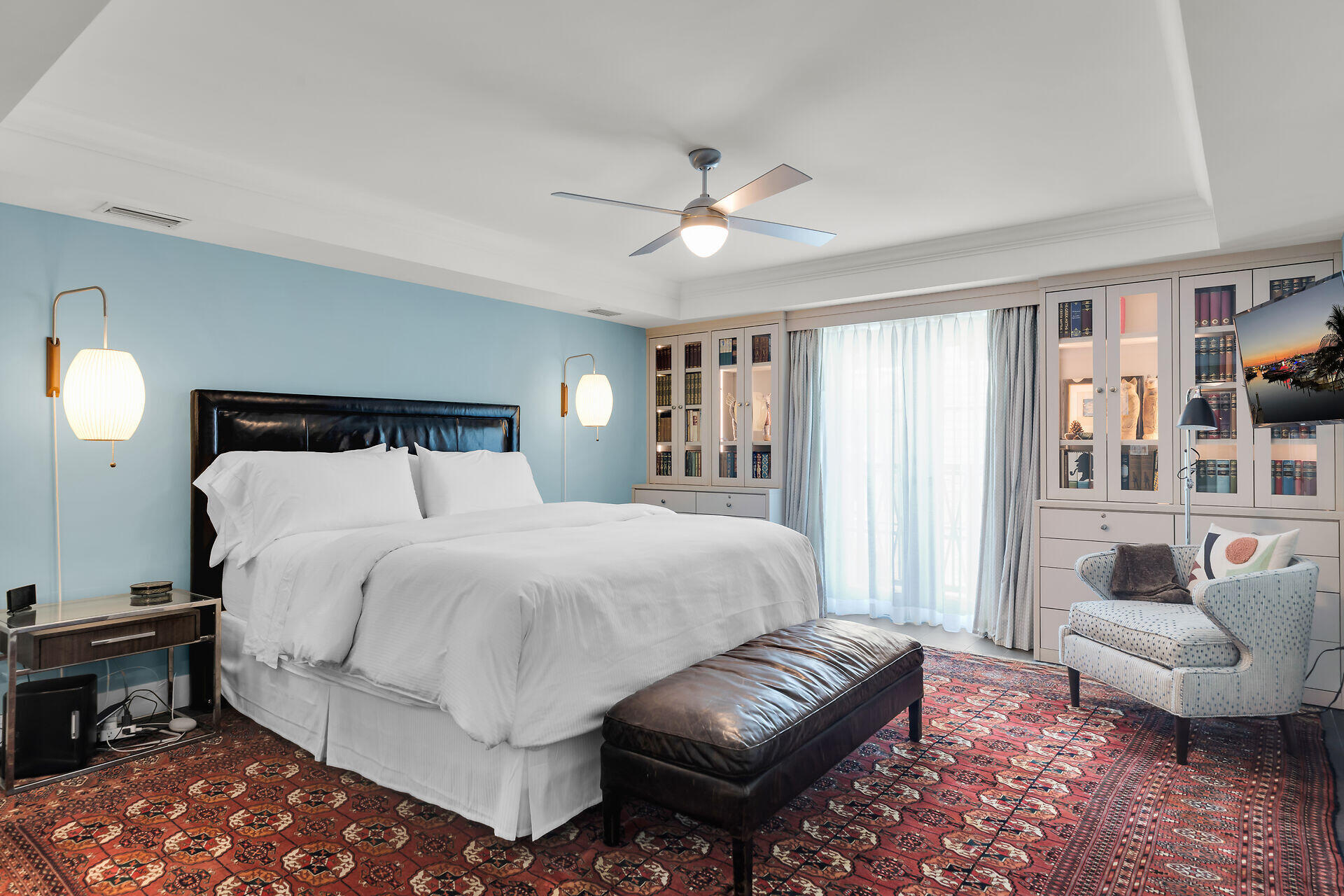 141 Simonton Street Key West, FL 33040 - Photo 23 of 49 a spacious bedroom with a bed a couch and a window