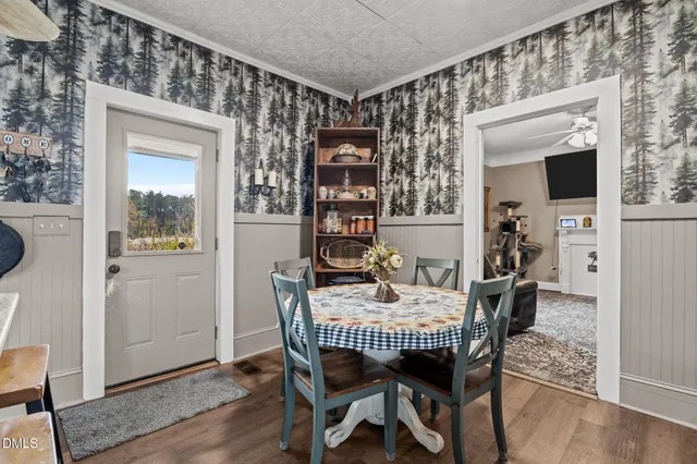 a living room with furniture and a rug