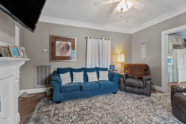 a bathroom with a granite countertop sink and a toilet
