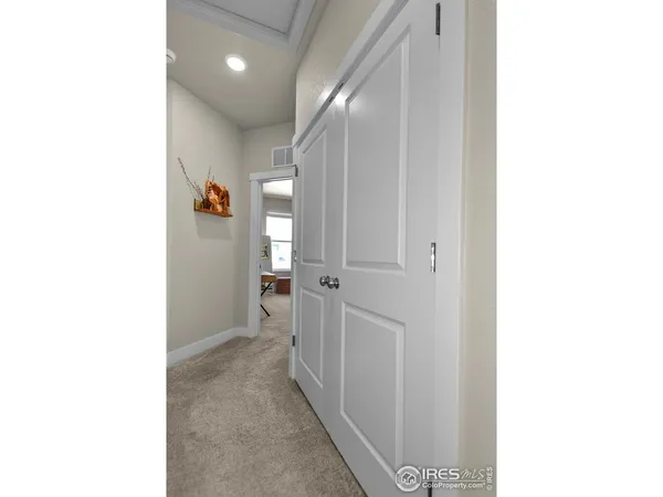 a view of a hallway with closet