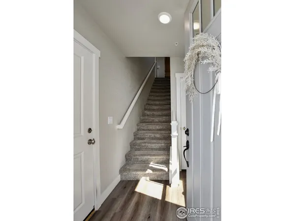 a view of entryway with wooden floor
