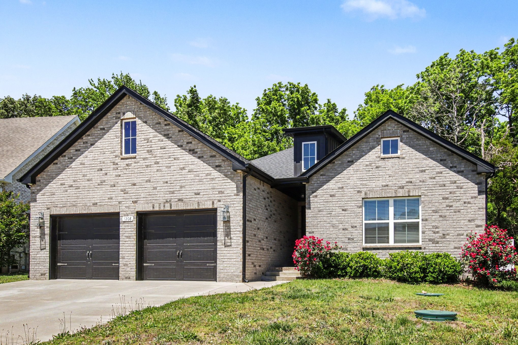 7208 Winding Way Pleasant View, TN 37146 - Photo 8 of 30 a front view of a house with garden