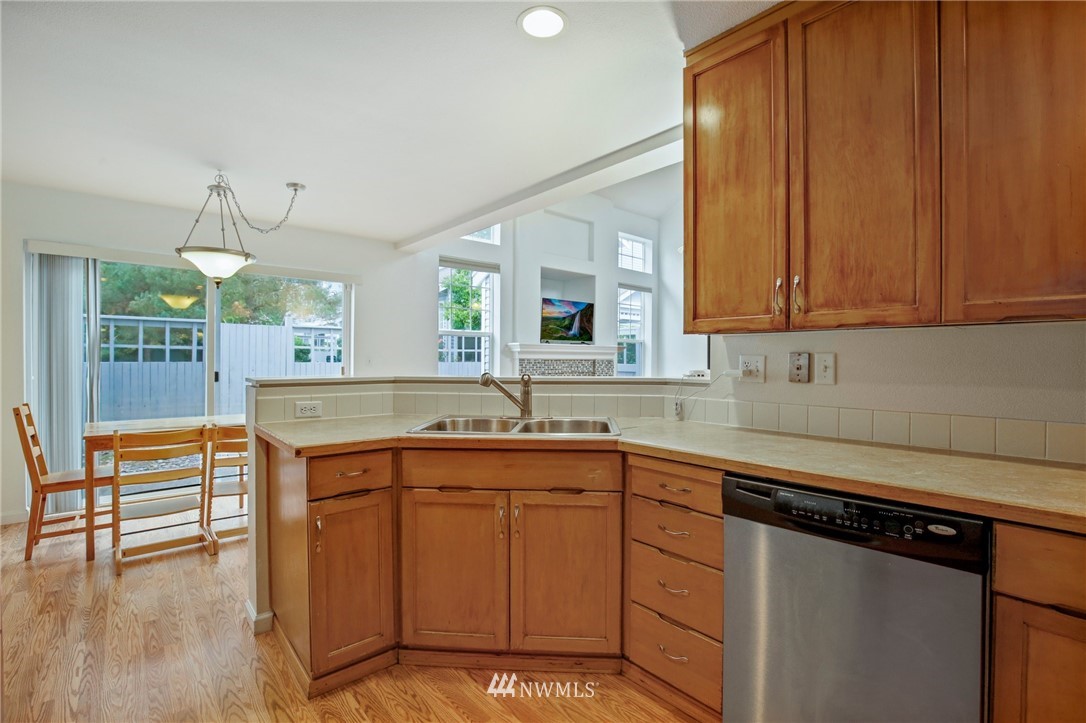 19131 110th Place Southeast Renton, WA 98055 - Photo 12 of 25 a kitchen with a sink cabinets and window