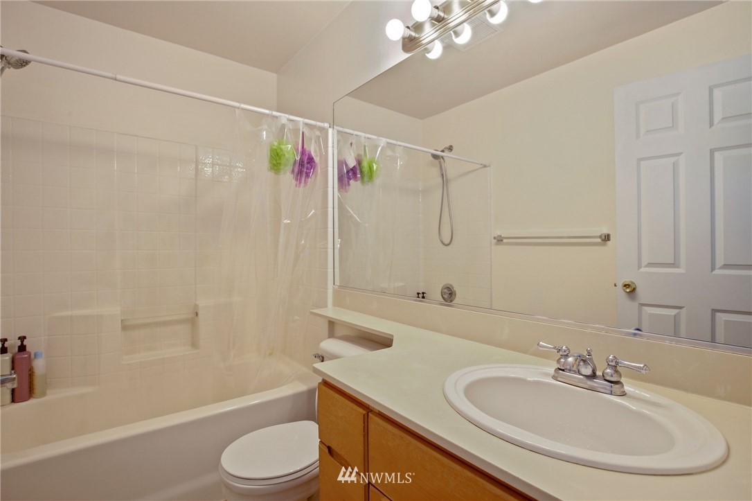 19131 110th Place Southeast Renton, WA 98055 - Photo 16 of 25 a bathroom with a sink toilet and shower