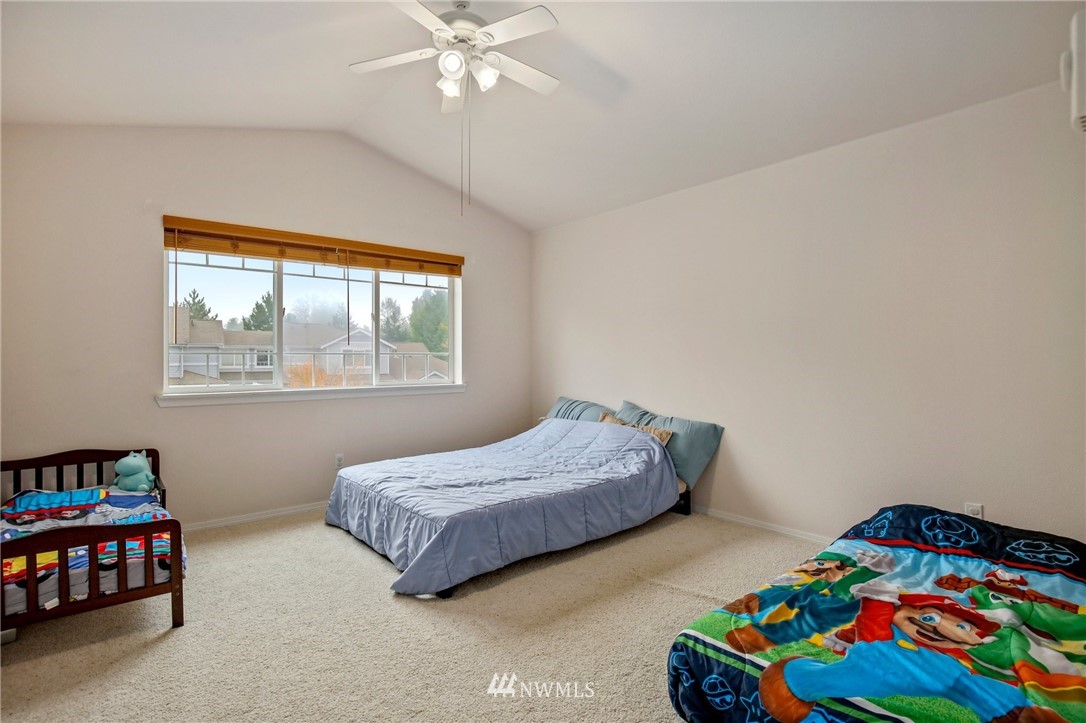 19131 110th Place Southeast Renton, WA 98055 - Photo 17 of 25 a bedroom with bed and a window