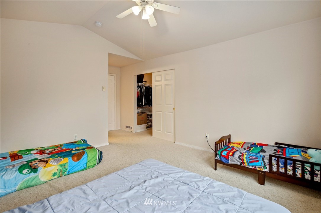 19131 110th Place Southeast Renton, WA 98055 - Photo 18 of 25 a bedroom with furniture and a baby crib