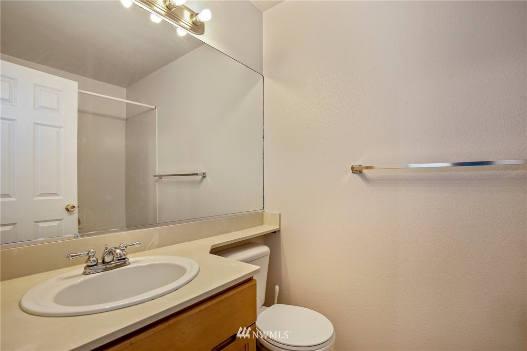 19131 110th Place Southeast Renton, WA 98055 - Photo 19 of 25 a bathroom with a sink toilet and a mirror
