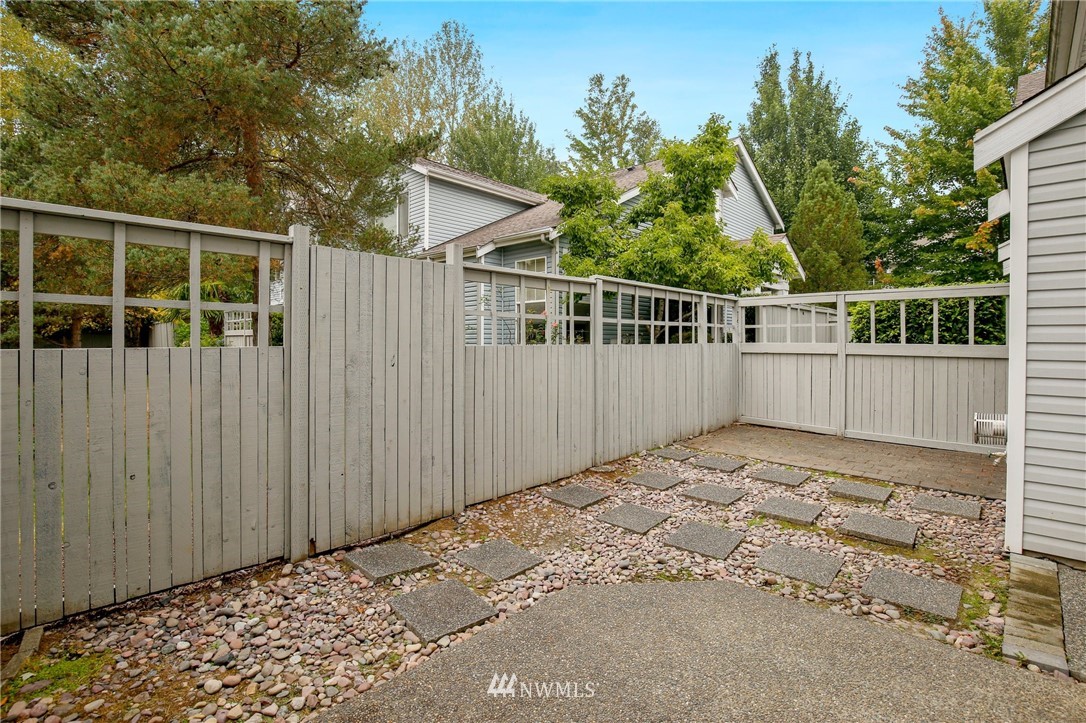 19131 110th Place Southeast Renton, WA 98055 - Photo 23 of 25 front view of a house with a wooden fence