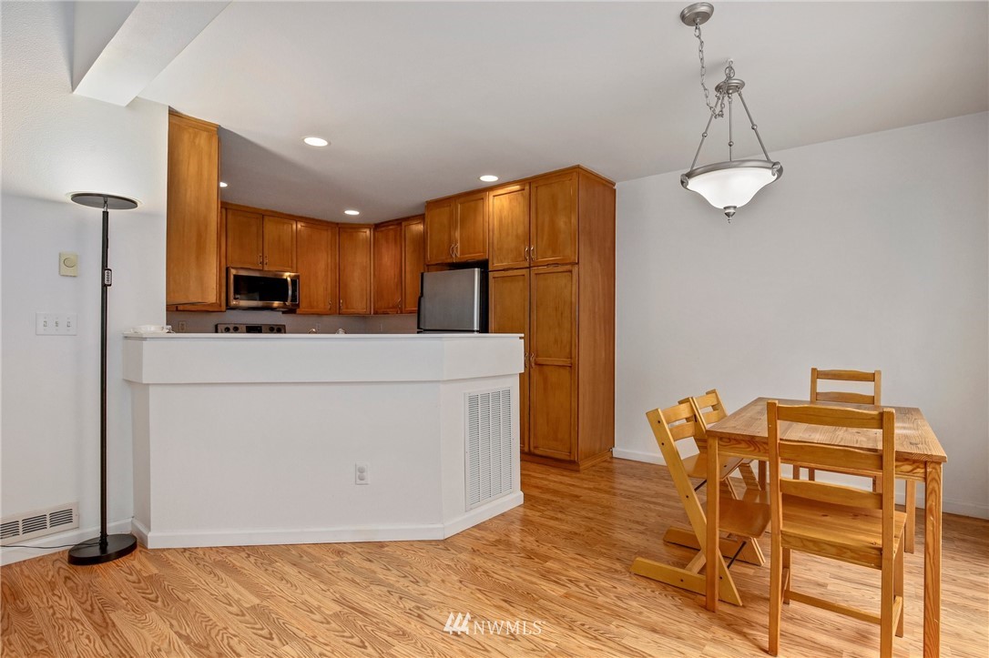 19131 110th Place Southeast Renton, WA 98055 - Photo 8 of 25 a room with stainless steel appliances lots of wooden furniture