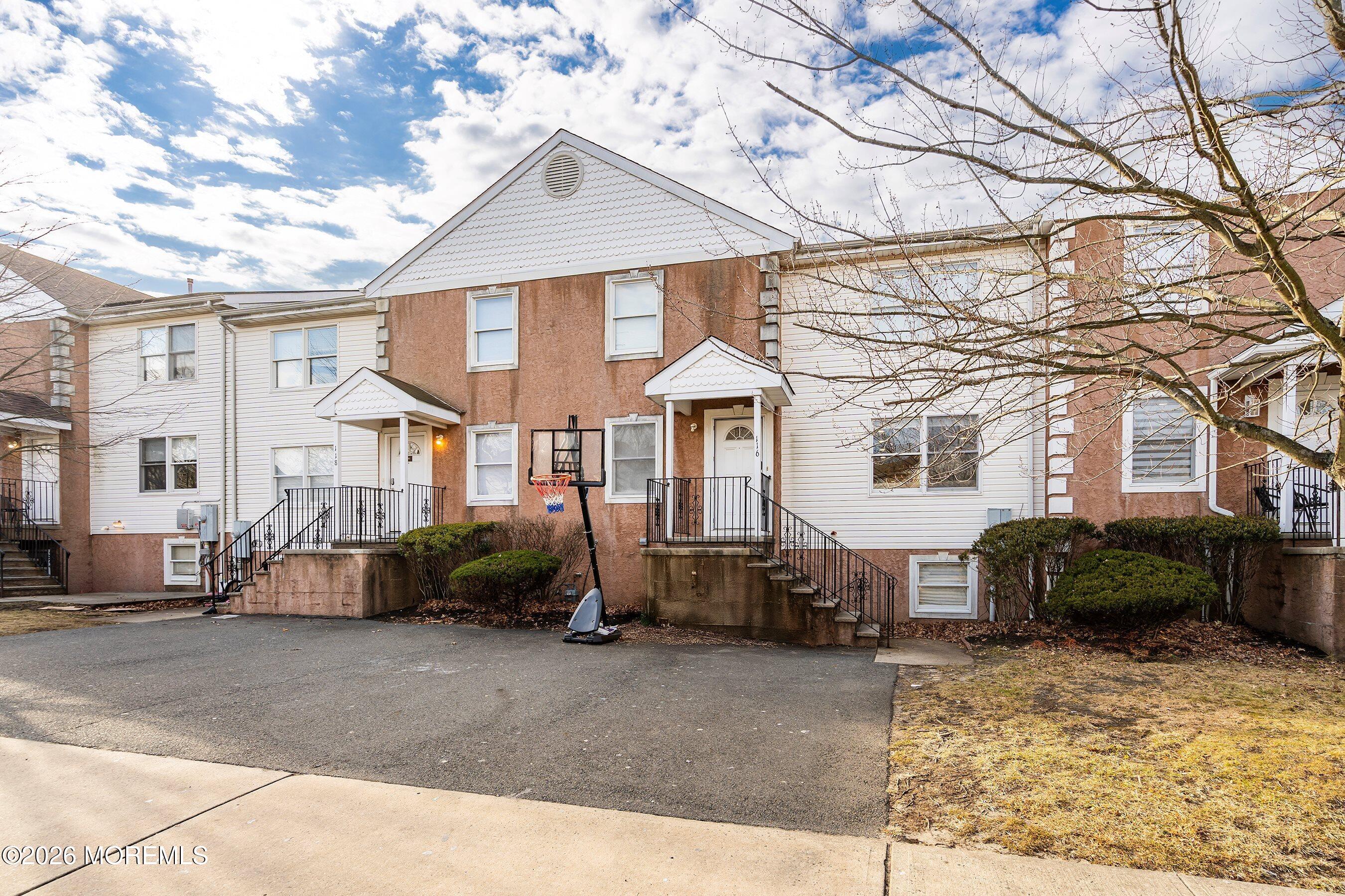 116 Ricky Lane Lakewood, NJ 08701 - Photo 3 of 15 a front view of a house with a yard