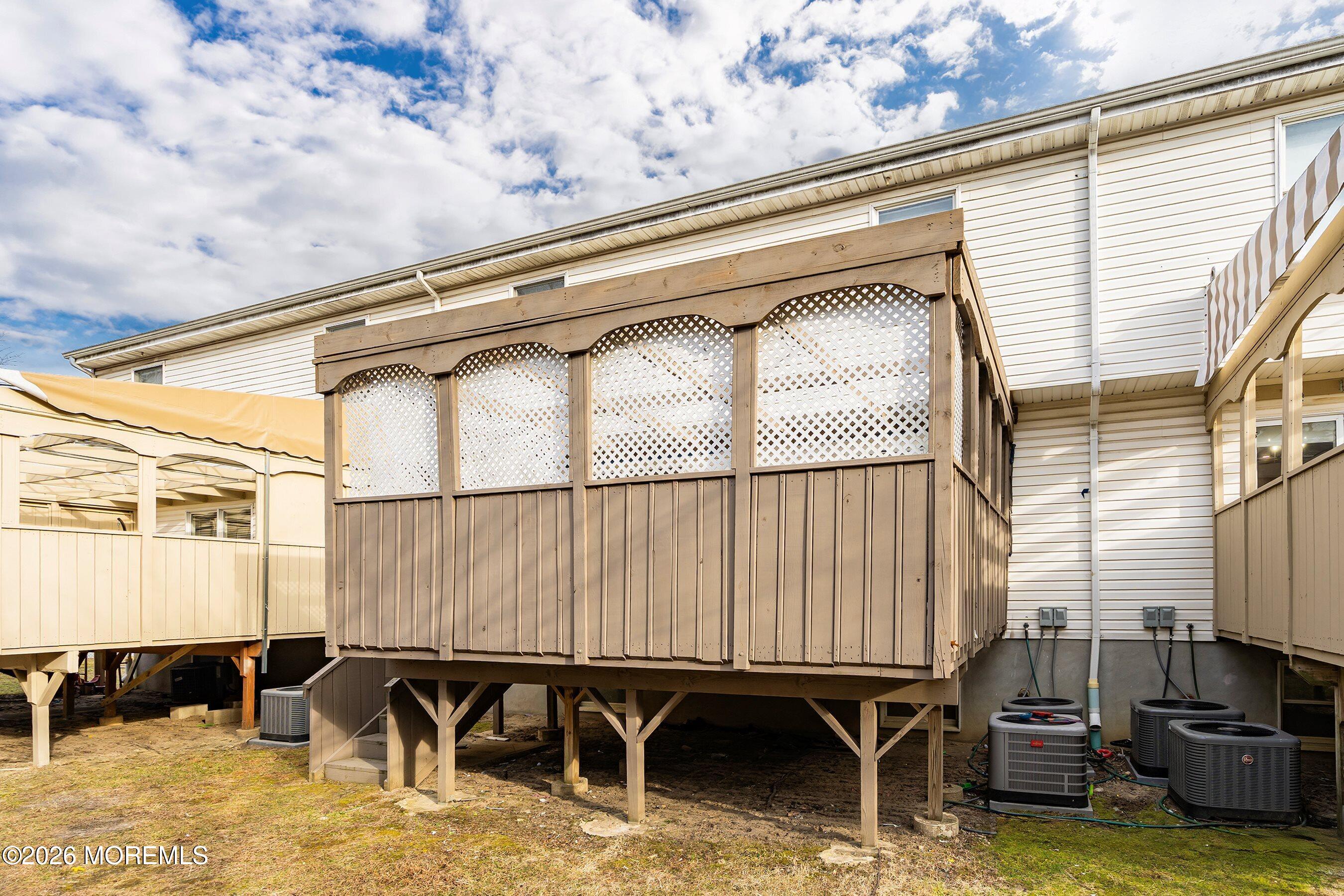 116 Ricky Lane Lakewood, NJ 08701 - Photo 9 of 15 a backyard of a house with barbeque oven table and chairs