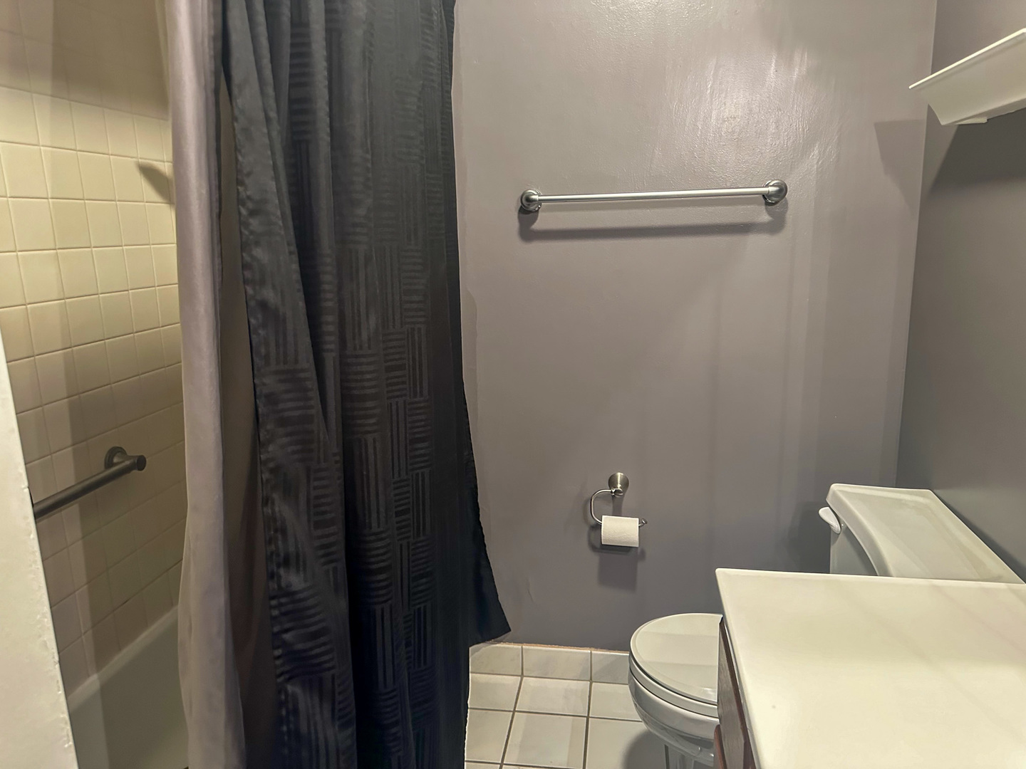 6315 North Post Oak Road Peoria, IL 61615 - Photo 14 of 31 a bathroom with a toilet and a shower