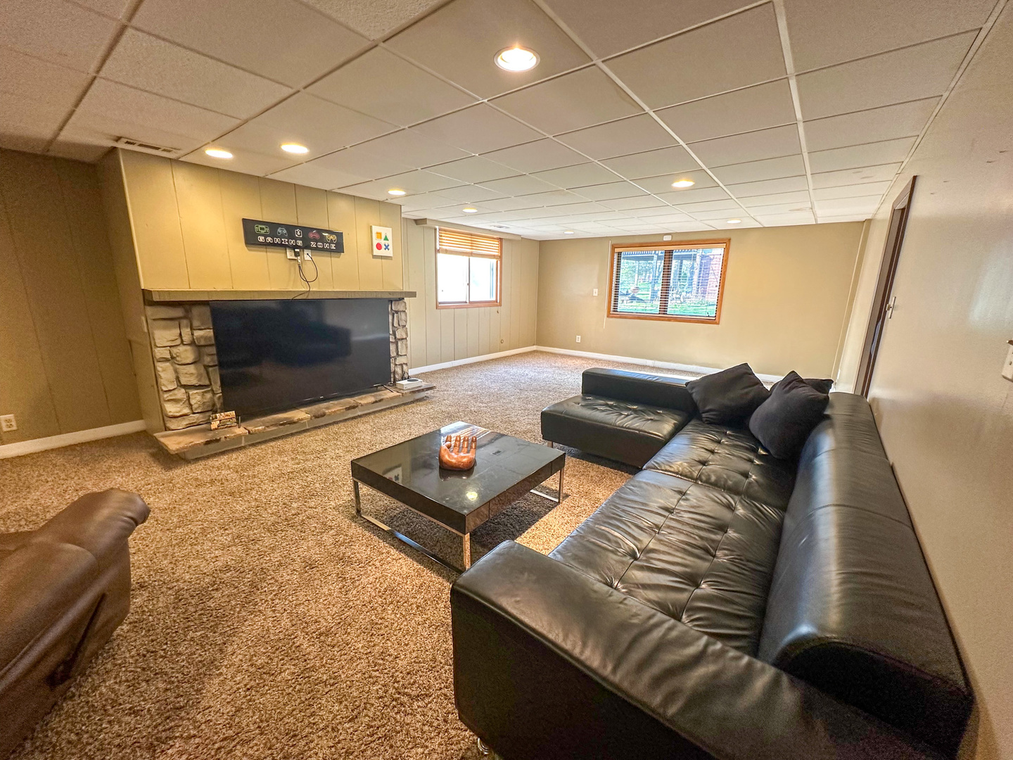 6315 North Post Oak Road Peoria, IL 61615 - Photo 19 of 31 a living room with furniture and a fireplace