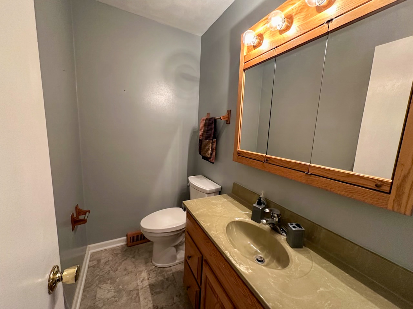 6315 North Post Oak Road Peoria, IL 61615 - Photo 24 of 31 a bathroom with a sink and a toilet