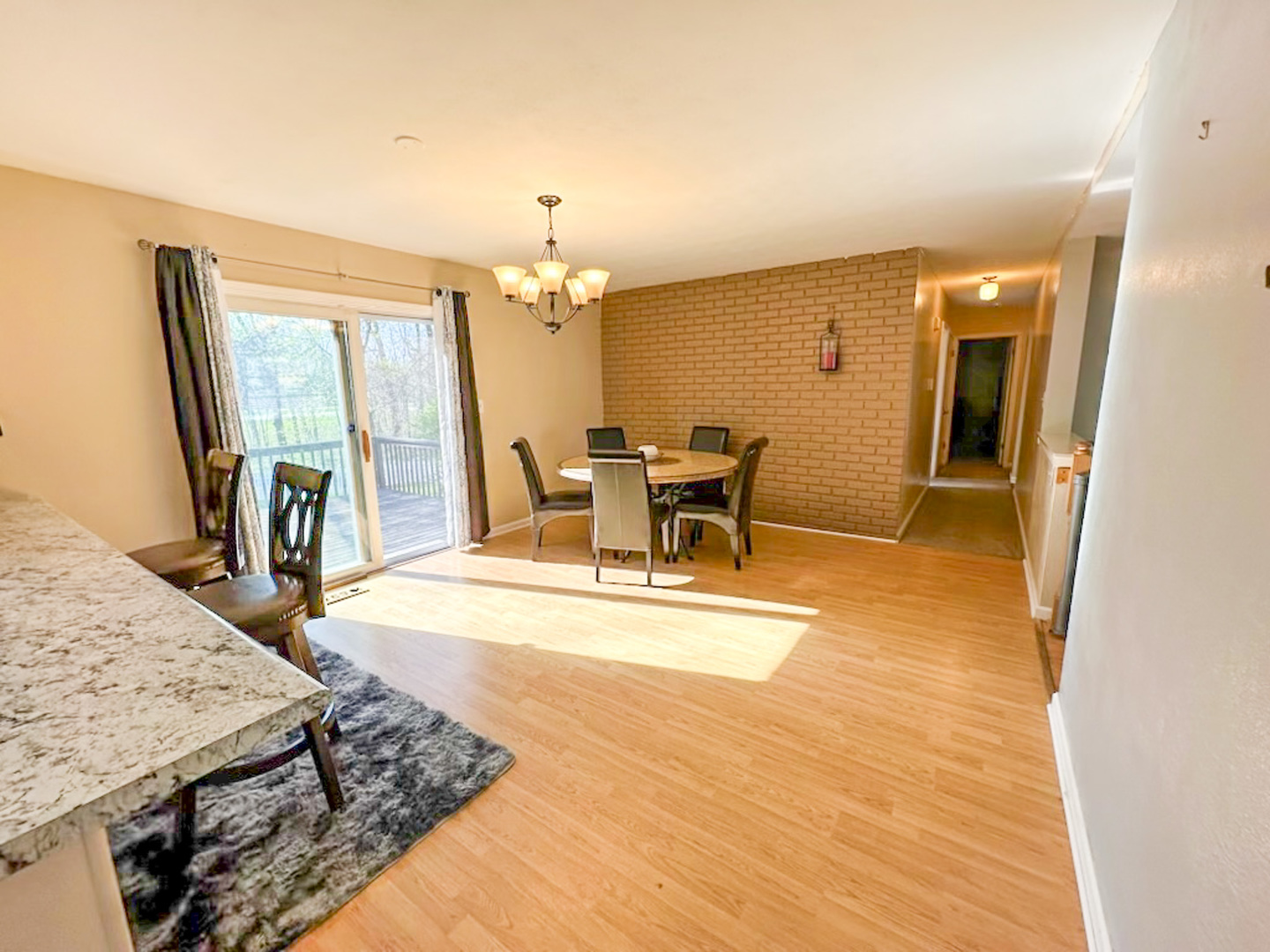 6315 North Post Oak Road Peoria, IL 61615 - Photo 8 of 31 a view of a livingroom with furniture window and wooden floor
