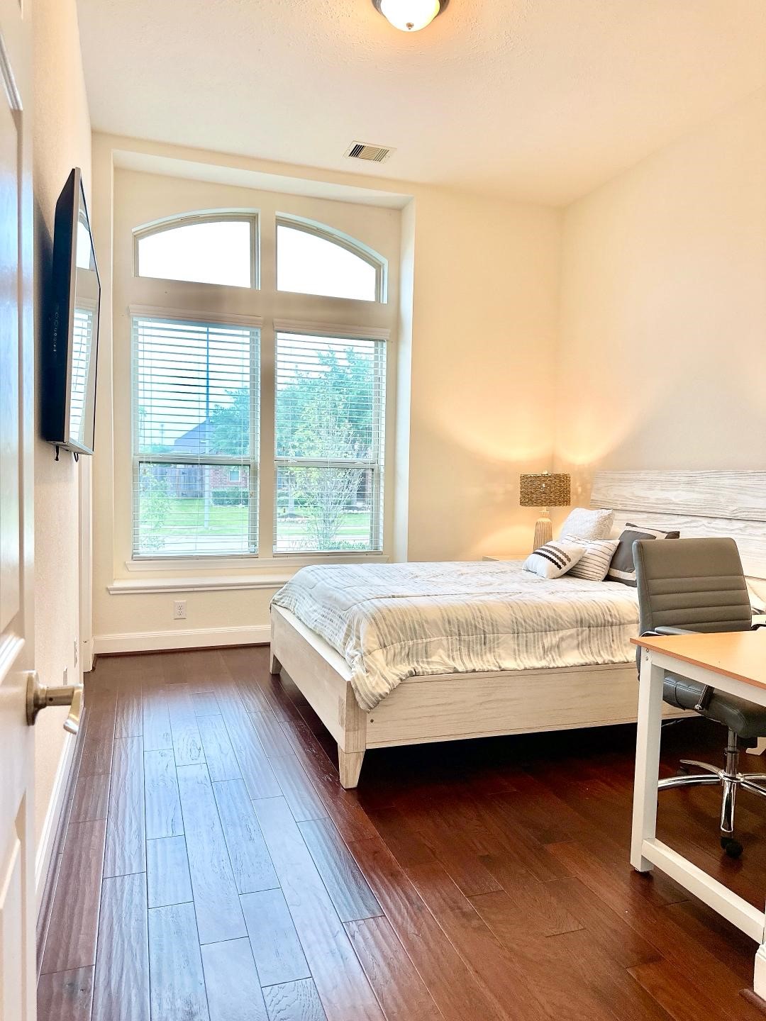 1110 Penny Ranch Lane Katy, TX 77494 - Photo 25 of 31 a bedroom with a bed and a window