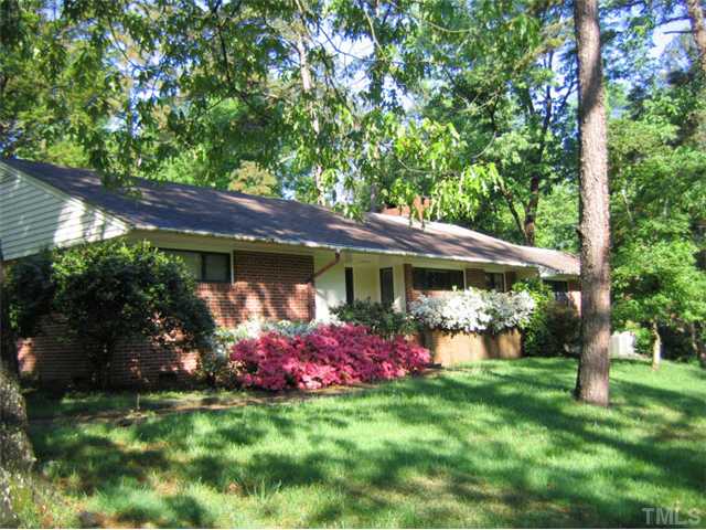 1105 Woodburn Road Durham, NC 27705 - Photo 1 of 11 Yard blooming in the spring