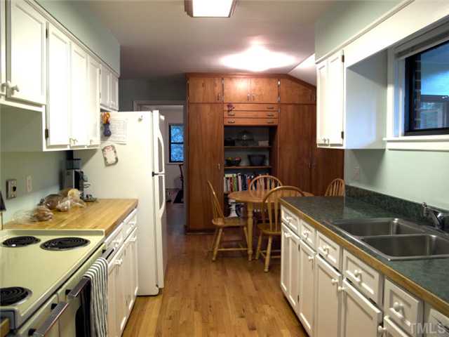 1105 Woodburn Road Durham, NC 27705 - Photo 5 of 11 A galley style kitchen popular in the 50's is amazingly efficient today. Lots of counterspace and storage but few steps.