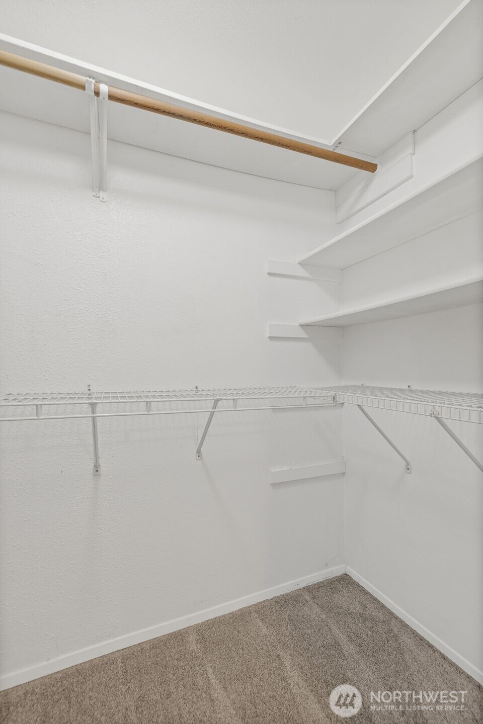 10824 Southeast 170th Street, Unit B103 Renton, WA 98055 - Photo 20 of 31 a view of a room with racks on the wall