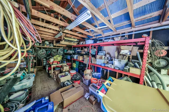 a view of balcony with wooden floor and fence