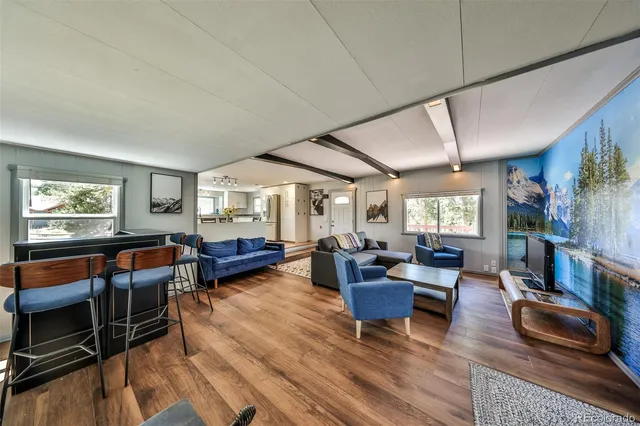 a dining room with furniture and window