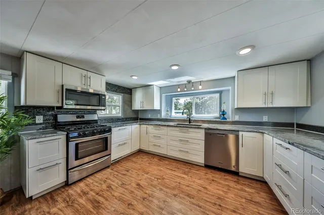 a bedroom with a bed and a lamp on table