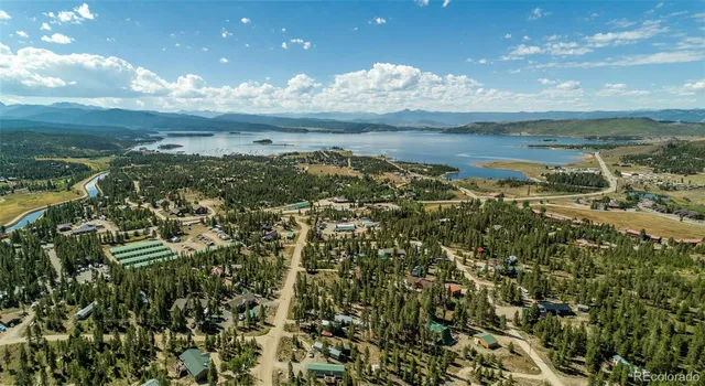 a view of a city with mountains in the background
