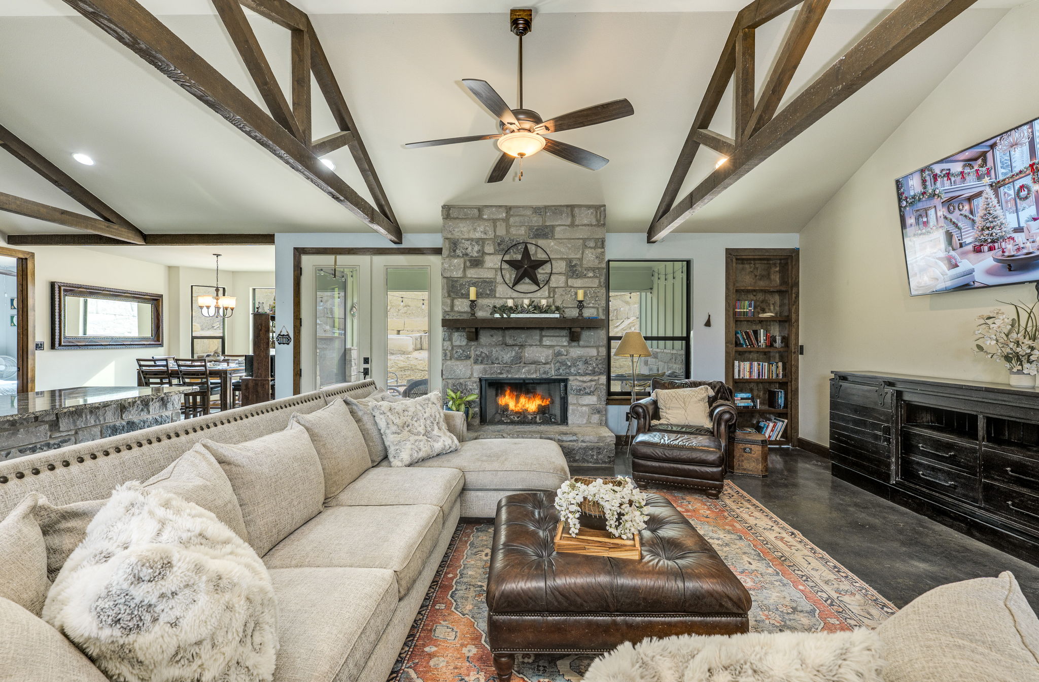 10837 Deer Canyon Road Jonestown, TX 78645 - Photo 5 of 19 a living room with furniture and a fireplace