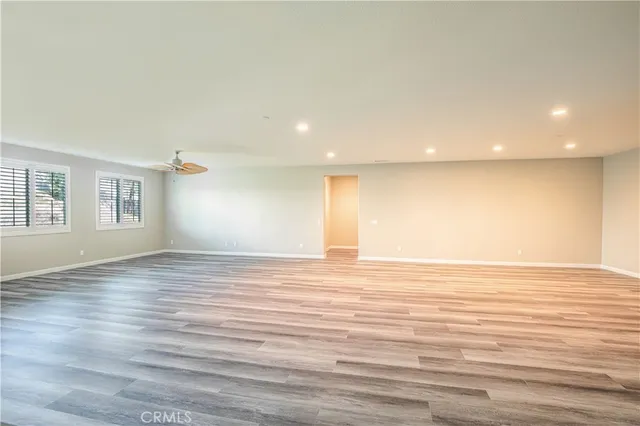 a spacious bathroom with a double vanity sink a mirror and a bathtub