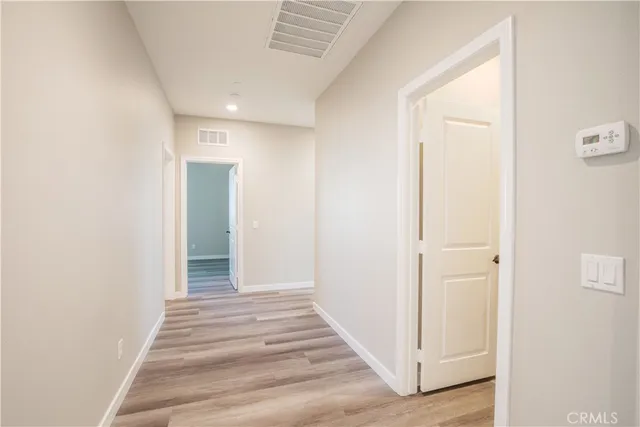 a spacious bathroom with a double vanity sink a mirror and a bathtub