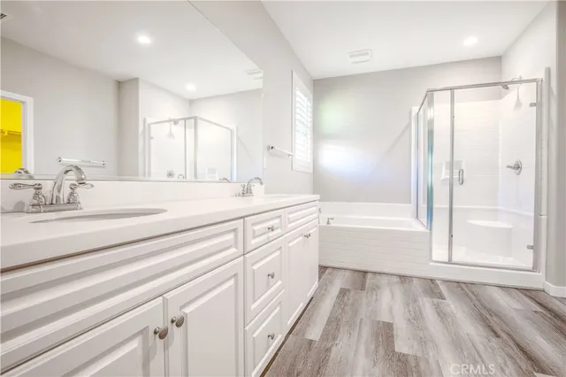 a spacious bathroom with a sink a toilet and a bathtub