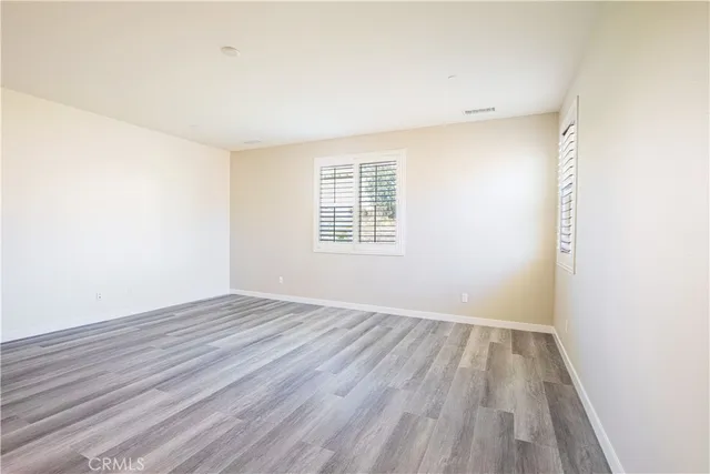a view of room with window and hardwood floor