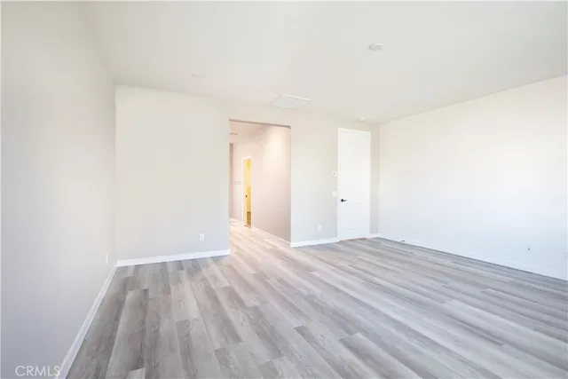 a view of a room with wooden floor and small space