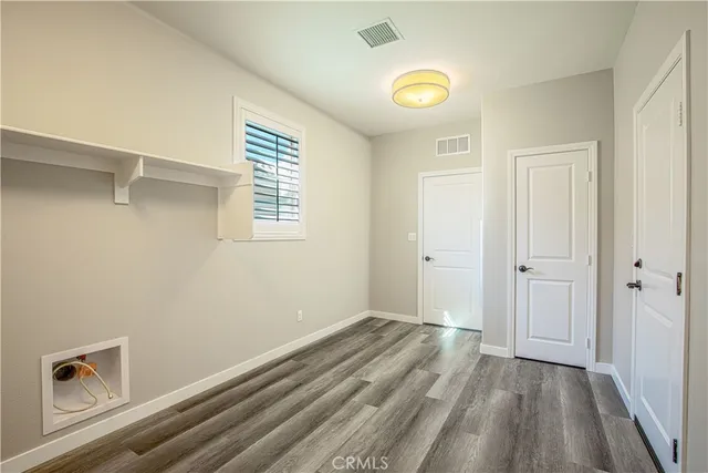 a view of a backyard with potted plants