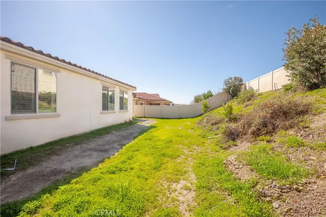 an aerial view of a house with a garden