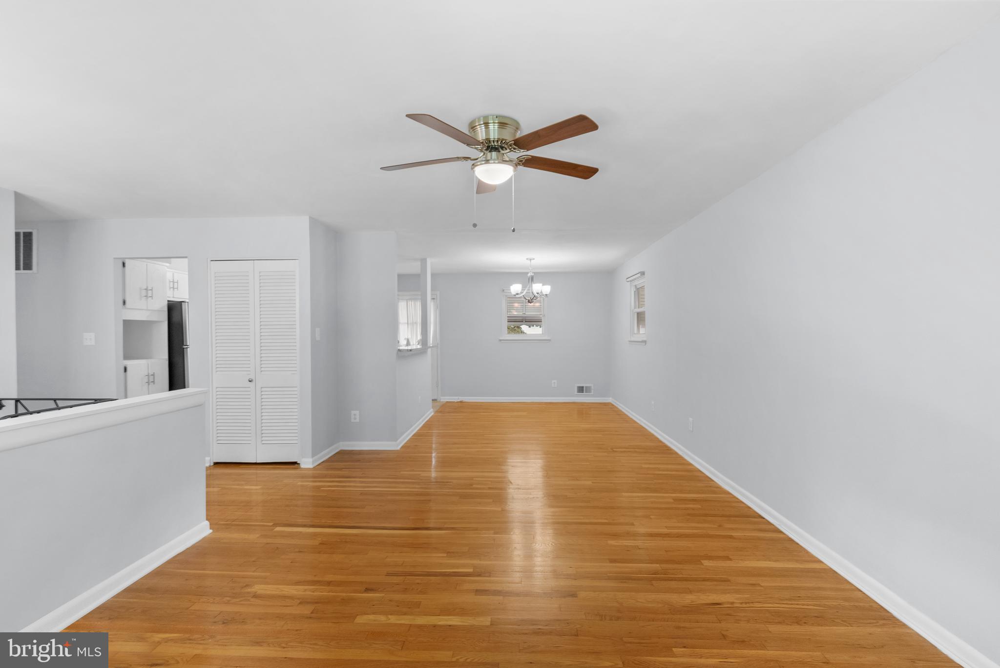 1201 Chillum Manor Road Hyattsville, MD 20783 - Photo 12 of 49 a view of a livingroom with a ceiling fan and wooden floor