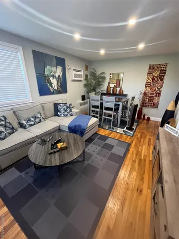 a view of a living room and dining room