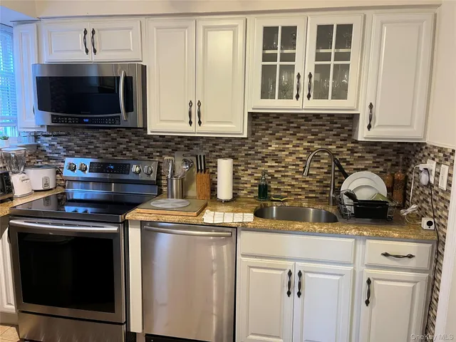 a kitchen with a stove and a microwave