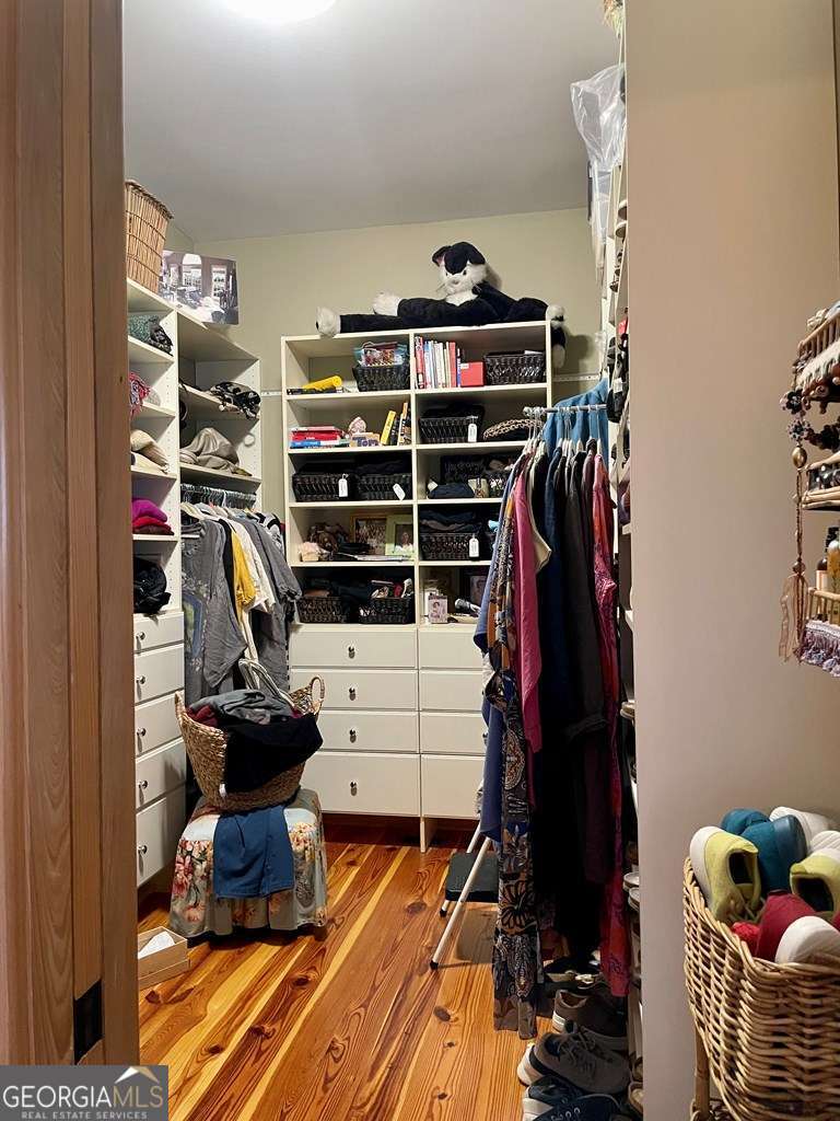 2106 Adams Street Vidalia, GA 30474 - Photo 16 of 47 a view of walk in closet with clothes and shoes