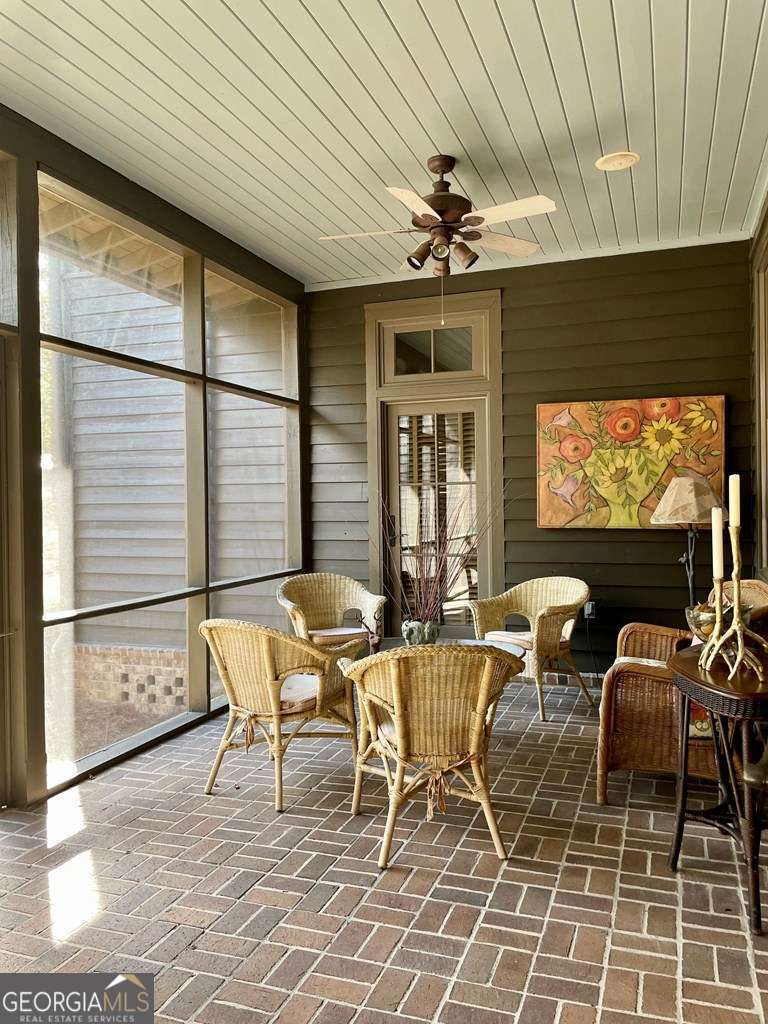 2106 Adams Street Vidalia, GA 30474 - Photo 23 of 47 a view of a dining room with furniture a chandelier and window