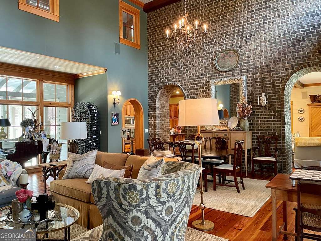 2106 Adams Street Vidalia, GA 30474 - Photo 3 of 47 a living room with couches a fireplace and a potted plant