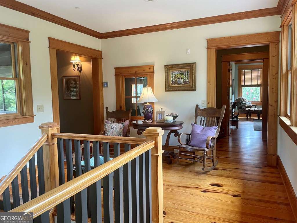 2106 Adams Street Vidalia, GA 30474 - Photo 32 of 47 a living room with furniture and a wooden floor