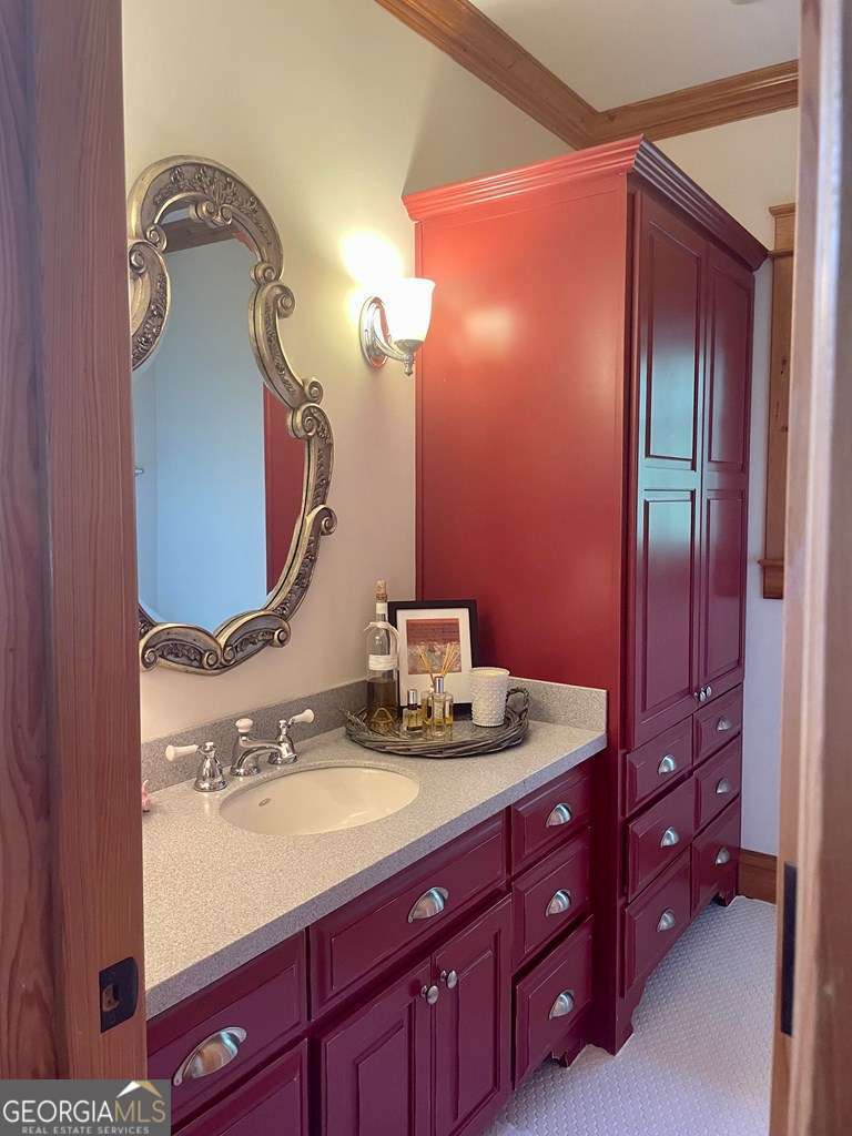 2106 Adams Street Vidalia, GA 30474 - Photo 37 of 47 a bathroom with a sink and a mirror